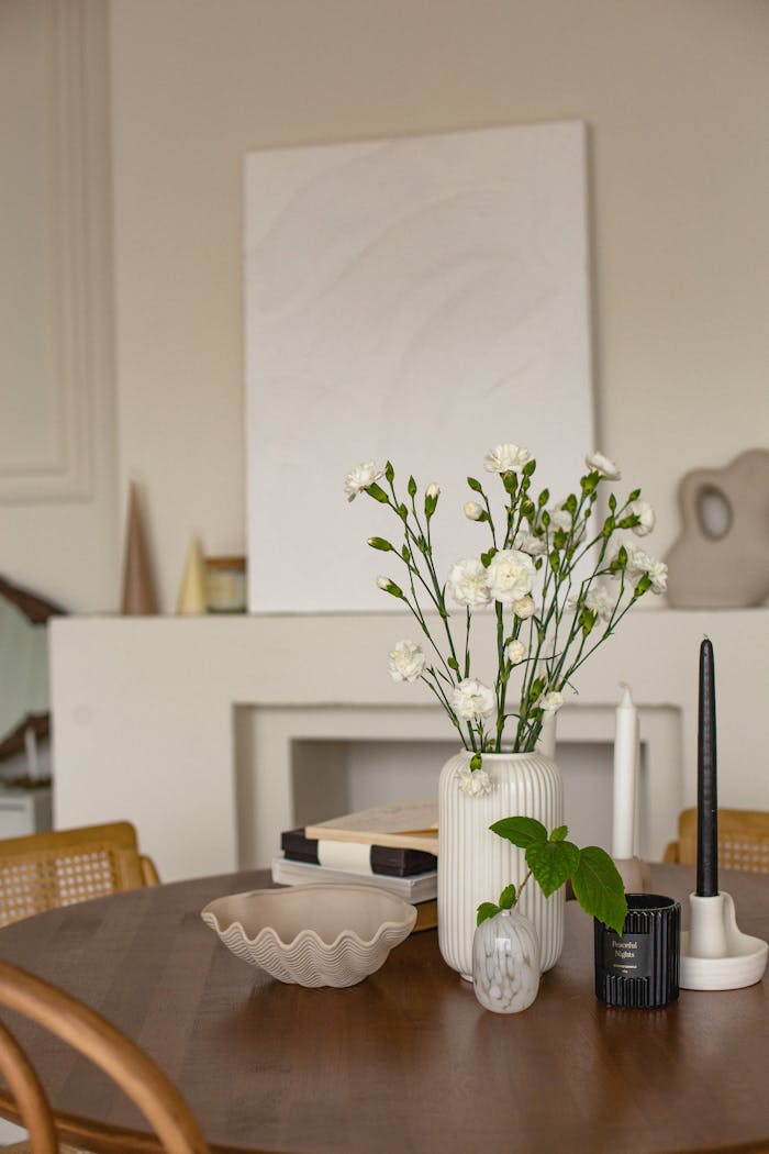 Sophisticated room featuring a floral centerpiece on a wooden table, perfect for modern decor inspiration.